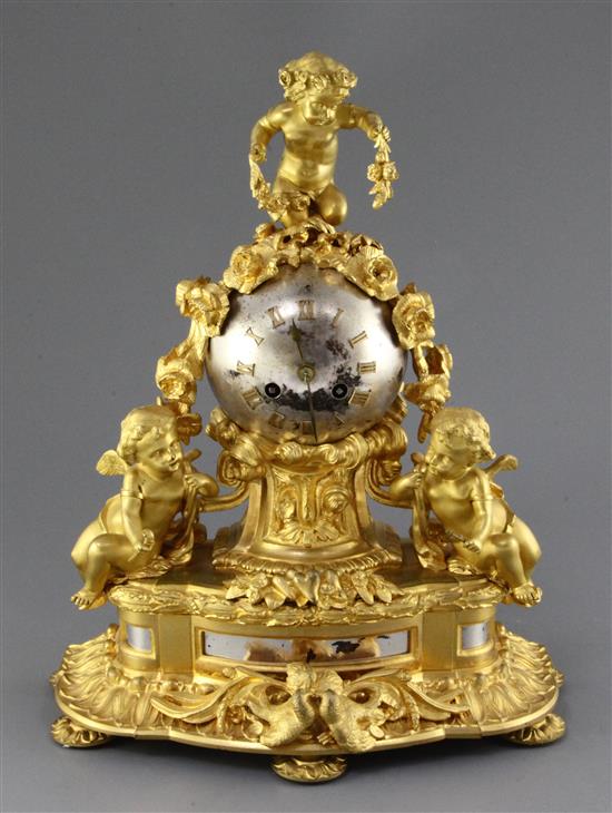 A mid 19th century French ormolu and silvered bronze mantel clock, 14.5in.